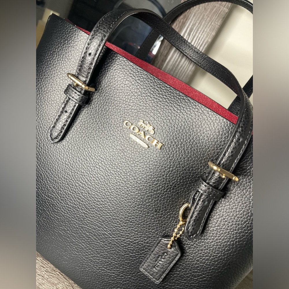 Buy with Confidence, Black coach bag with res interior.